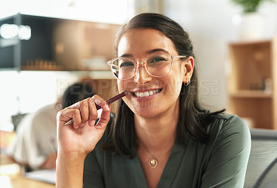 Buy stock photo Shot of a young businesswoman feeling happy at work