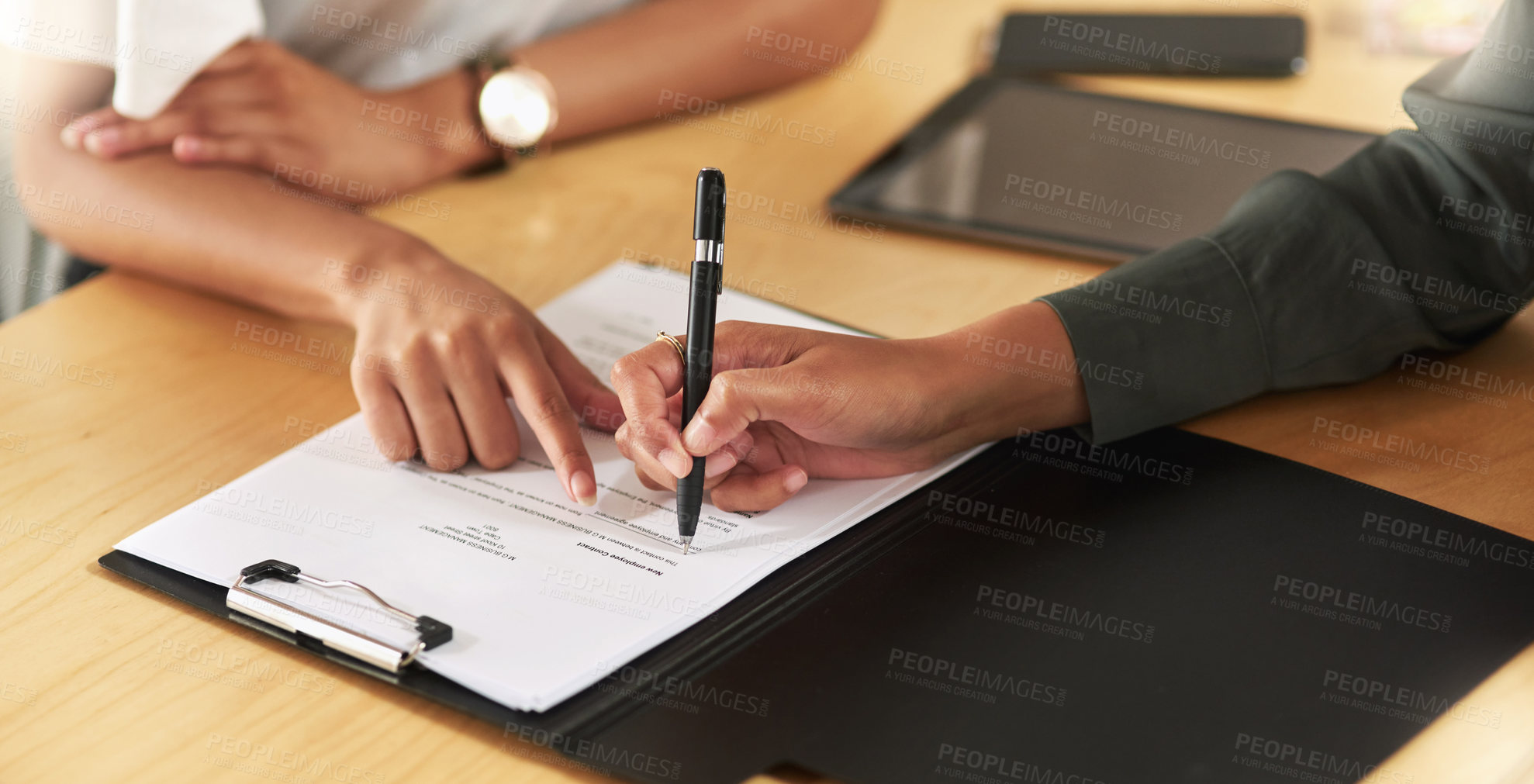 Buy stock photo Shot of a businesswoman signing a contract at work