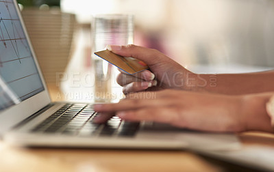 Buy stock photo Shot of a businesswoman using her laptop to make online purchases