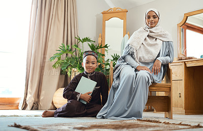 Buy stock photo Shot of a young muslim mother spending time with her son at home