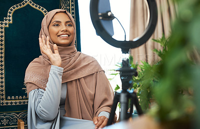 Buy stock photo Shot of a young muslim female busy recording her for her vlog