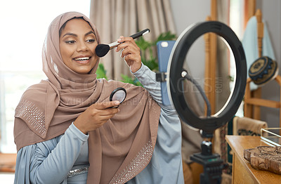 Buy stock photo Shot of a young muslim female busy recording her for her vlog