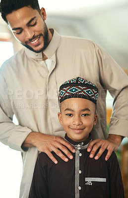 Buy stock photo Shot a young boy stand with his father at home