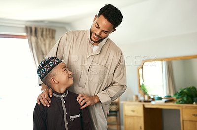 Buy stock photo Shot a young boy stand with his father at home