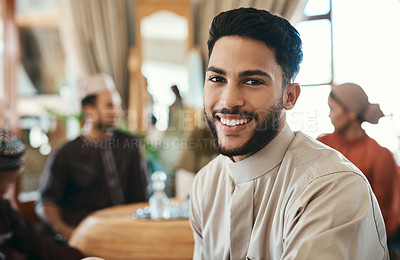 Buy stock photo Shot of a young businessman spending time with his family during ramadan