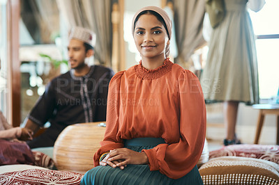 Buy stock photo Shot of a young muslim woman sitting down