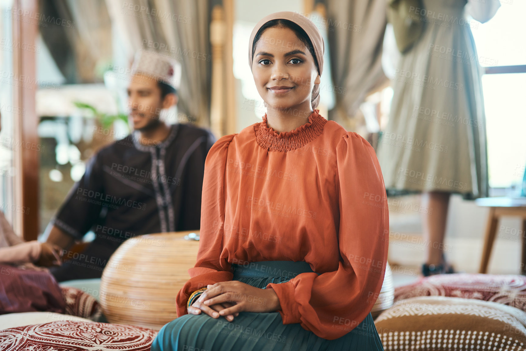 Buy stock photo Shot of a young muslim woman sitting down