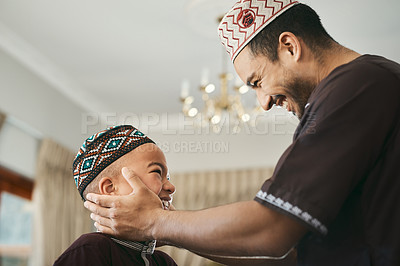 Buy stock photo Shot of a muslim father gazing affectionately at his son