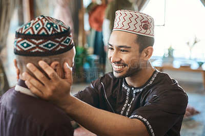 Buy stock photo Shot of a muslim father gazing affectionately at his son