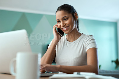 Buy stock photo Shot of a young woman using a laptop while on a call at home