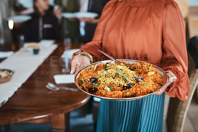 Buy stock photo Food, dinner and consumables with a traditional paella dish in the hands of a woman at home. Closeup of a bowl of spanish sea food, ready to serve and feed hungry family for lunch or healthy supper