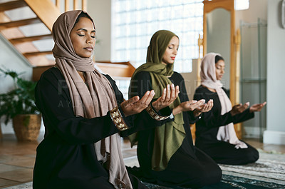 Buy stock photo Shot of a group of muslim women praying together