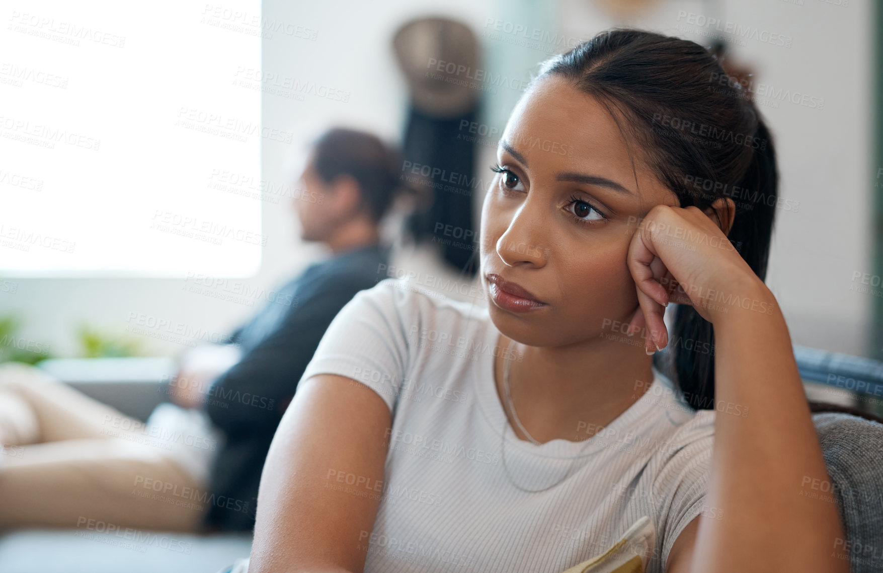 Buy stock photo Shot of a young couple having an argument at home