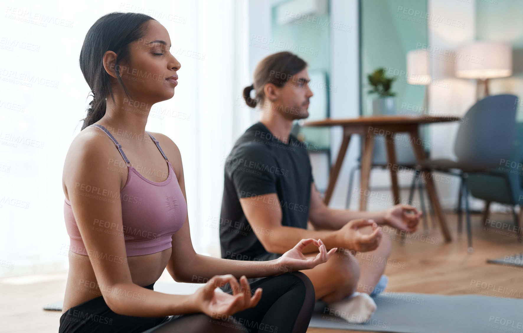 Buy stock photo Relax, yoga and couple in home, wellness and meditation for stress relief, balance and calm. Man, woman and lotus pose in living room, health benefits or holistic healing with zen, chakra and fitness