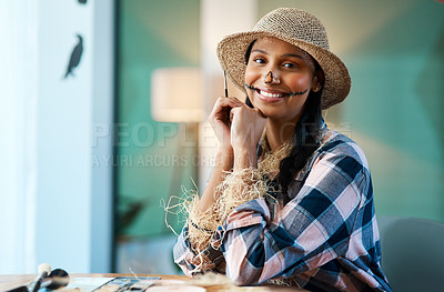 Buy stock photo Shot of a young woman applying halloween makeup at home