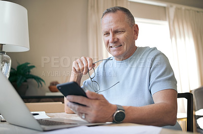 Buy stock photo Shot of a mature man using his smartphone to send messages