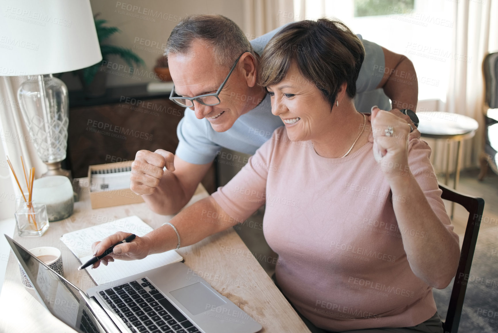 Buy stock photo Shot of a mature husband and wife using a laptop together