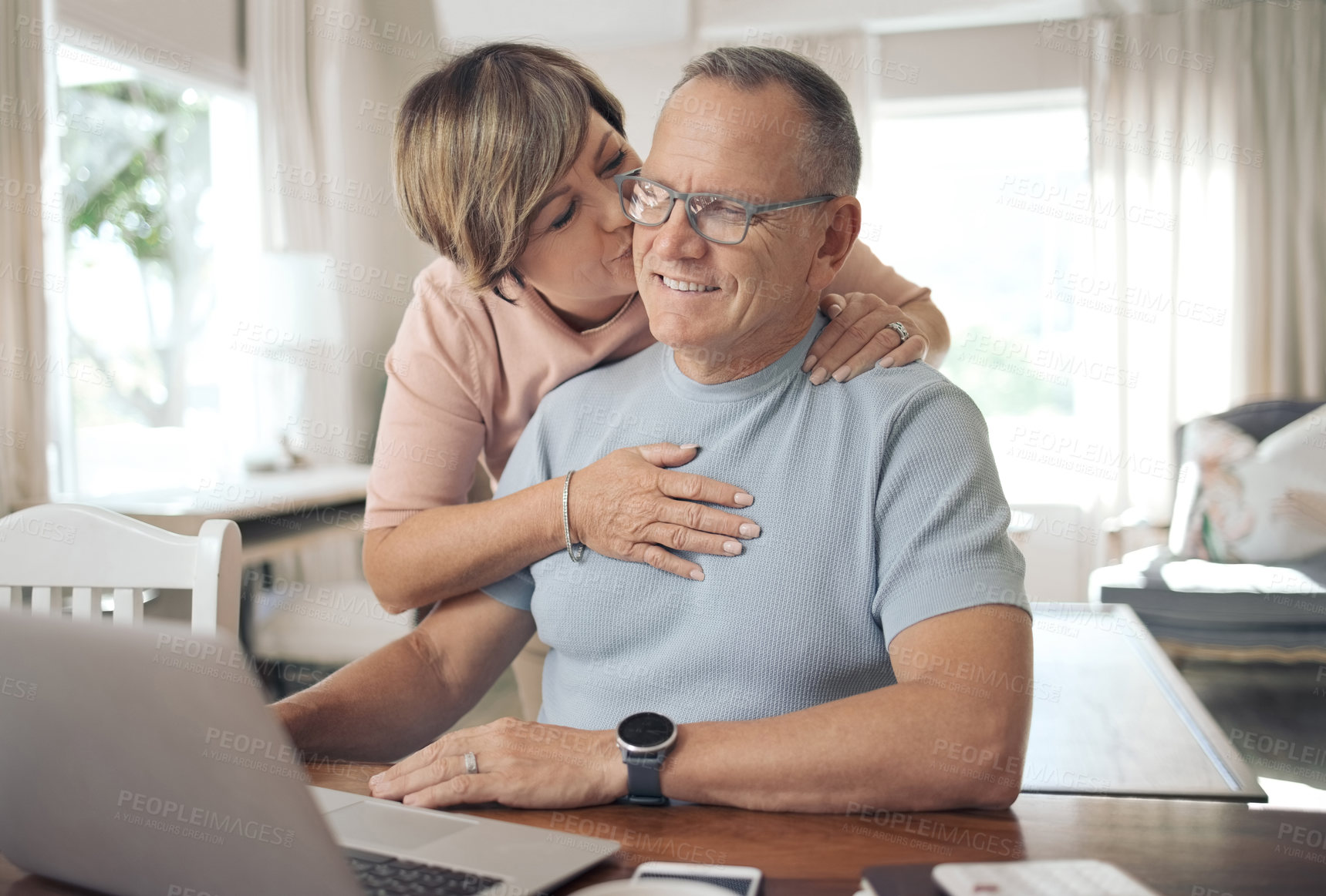 Buy stock photo Shot of a mature wife affectionately kissing her husband