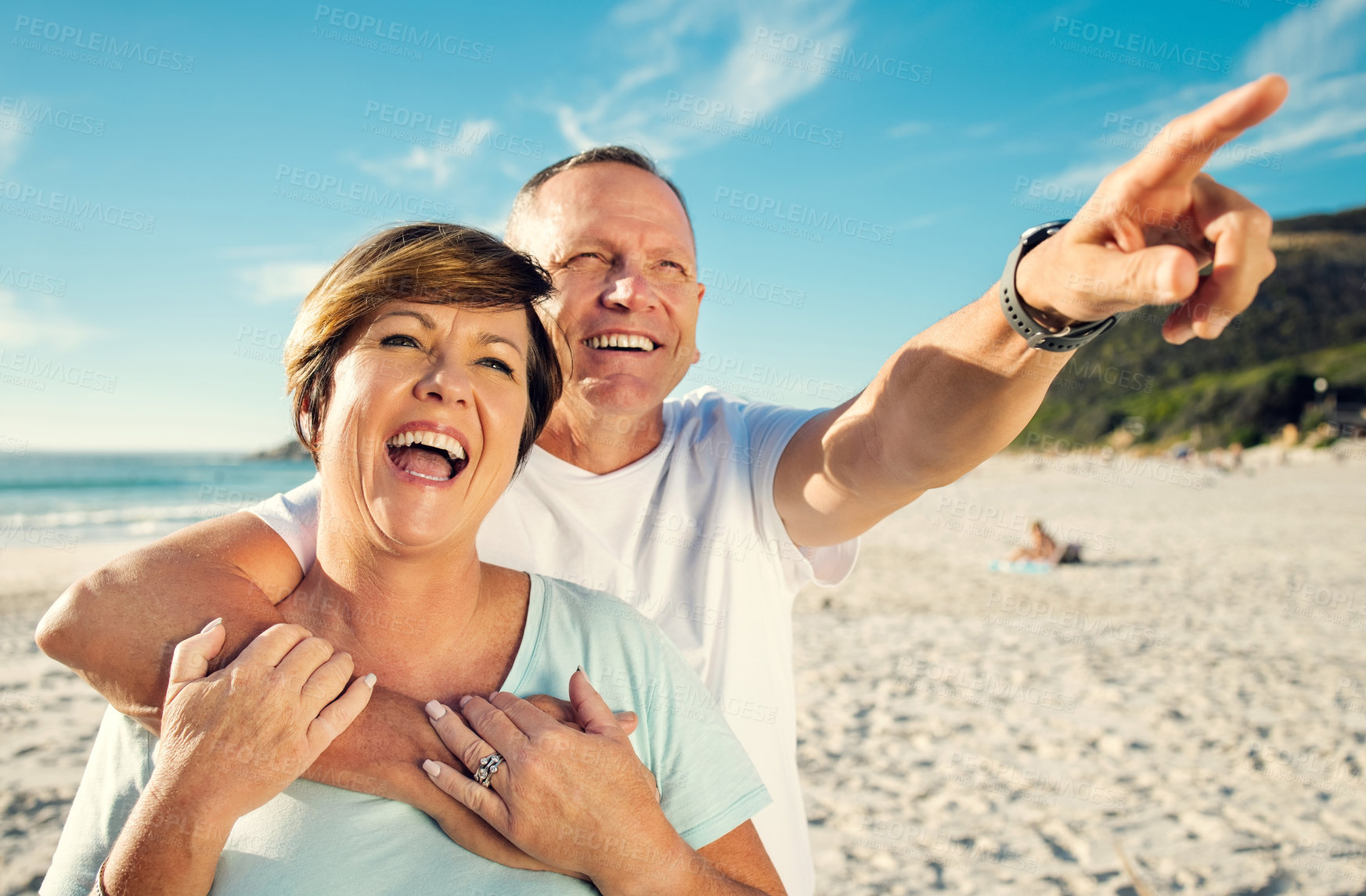 Buy stock photo Shot of a mature couple spending the day at the beach