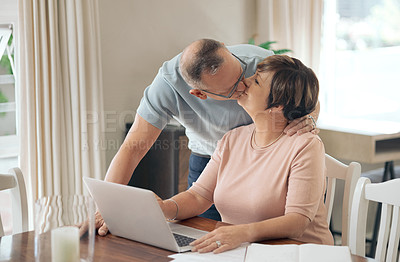 Buy stock photo Shot of a mature husband affectionately kissing his wife
