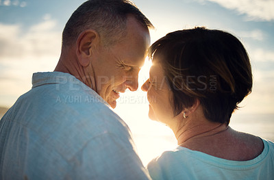 Buy stock photo Closeup shot of an affectionate couple spending the day at the beach