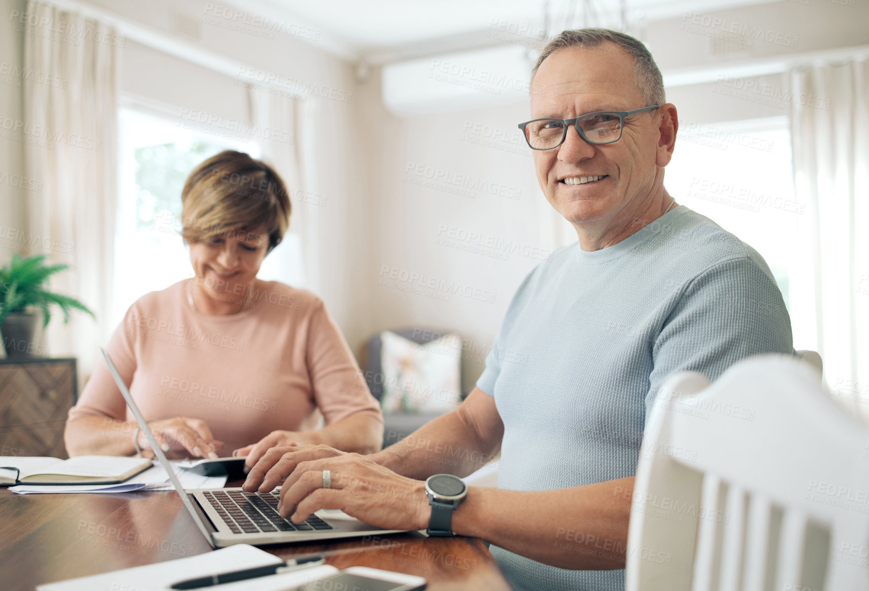 Buy stock photo Shot of a mature couple calculating their budget together