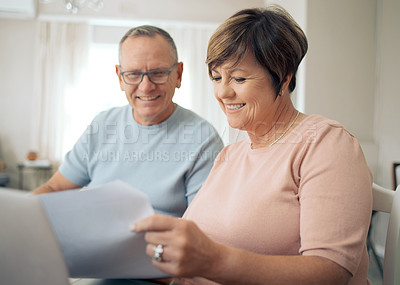 Buy stock photo Shot of a mature going over their bills together