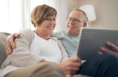 Buy stock photo Shot of a mature relaxing while using a digital tablet