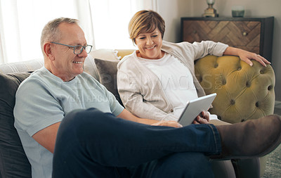Buy stock photo Shot of a mature relaxing while using a digital tablet