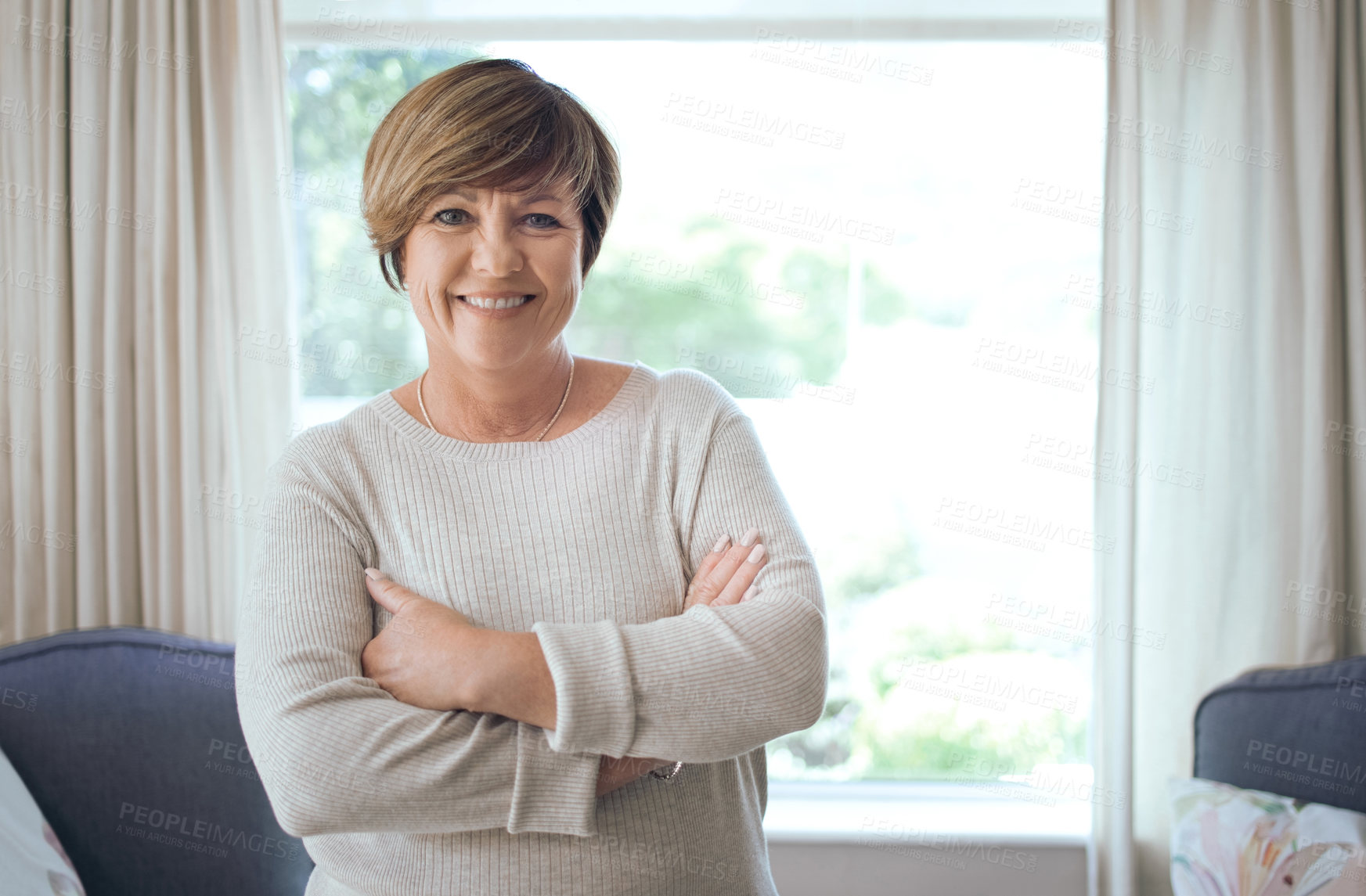 Buy stock photo Portrait, realtor and mature woman in home for property management, pride and about us. Smile, business person and arms crossed for real estate agent, confident consultant or career ambition in house
