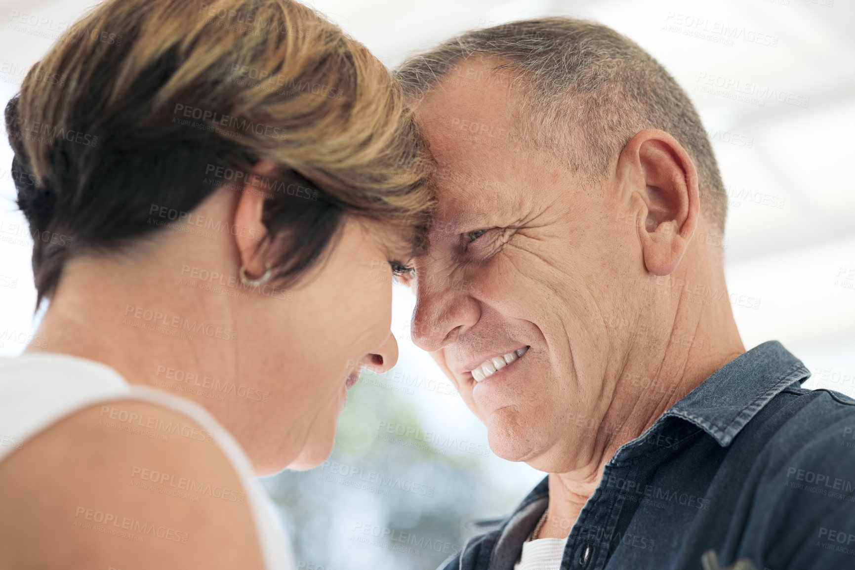 Buy stock photo Shot of a mature couple being affection