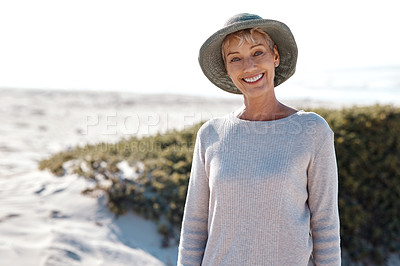 Buy stock photo Cropped portrait of an attractive mature woman standing on the beach