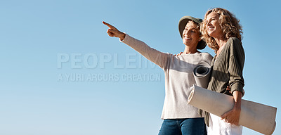 Buy stock photo Cropped shot of two attractive mature woman standing with their on the beach