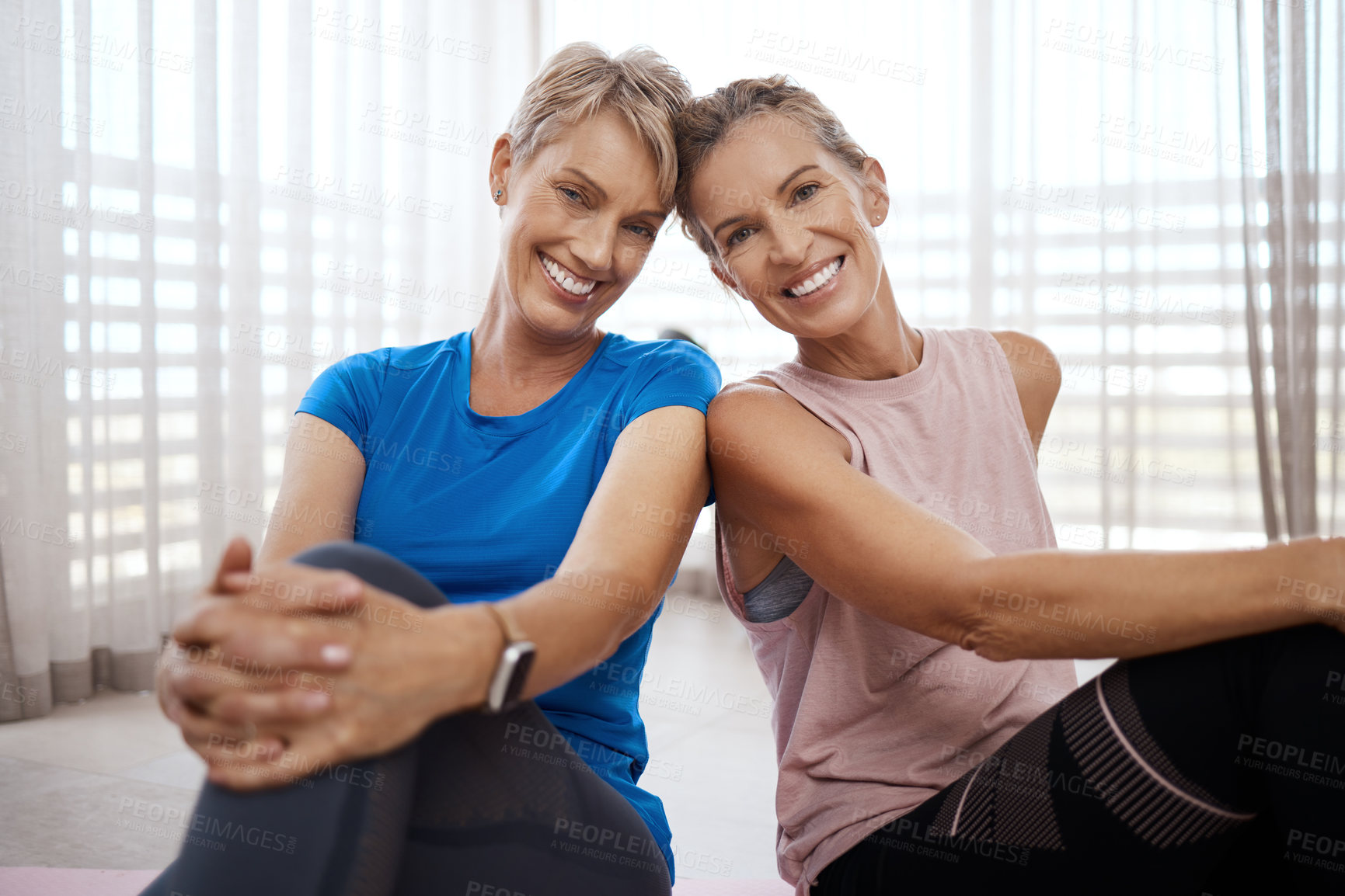 Buy stock photo Portrait of two women taking a break while exercising together at home