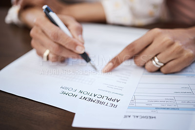 Buy stock photo Shot of a woman going over paperwork with her elderly mother at home