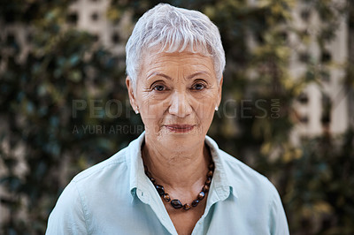 Buy stock photo Shot of a senior woman in the garden at home