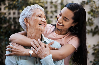 Buy stock photo Happy, hug and loving of a mother and woman in a garden on mothers day with care and gratitude together. Smile, family and an adult daughter hugging a senior mom in a backyard or park for happiness