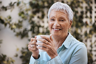 Buy stock photo Shot of a senior woman having coffee in the garden at home