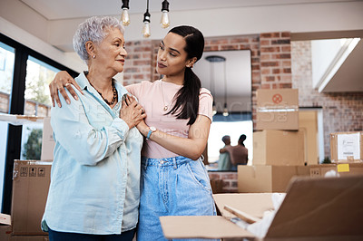Buy stock photo Shot of a senior woman moving house with help from her daughter