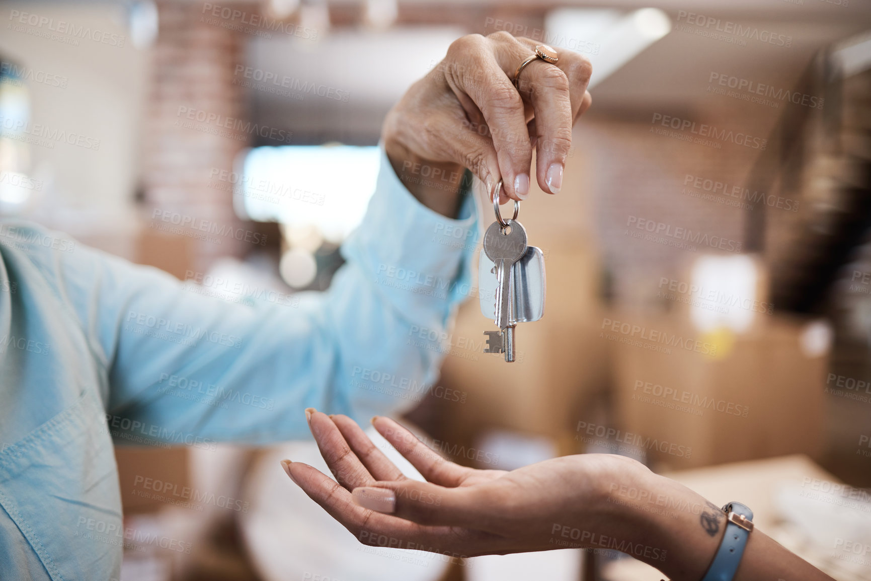Buy stock photo Shot of an unrecognisable handing over the keys to a new house