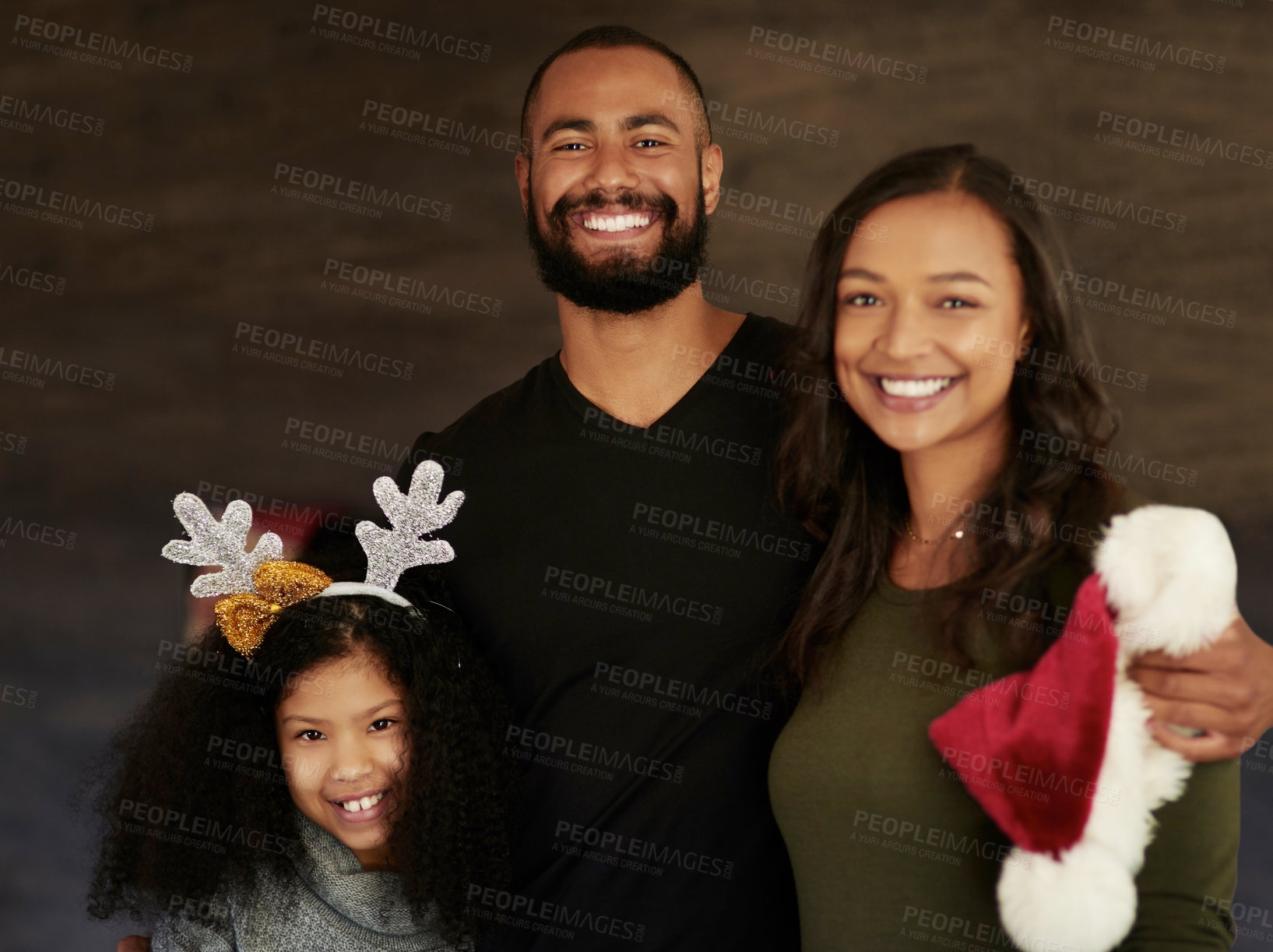 Buy stock photo Christmas, hug and portrait of a family with love, care and smile during holiday celebration in their house. Affection, happiness and girl with mother and father to celebrate xmas in their home