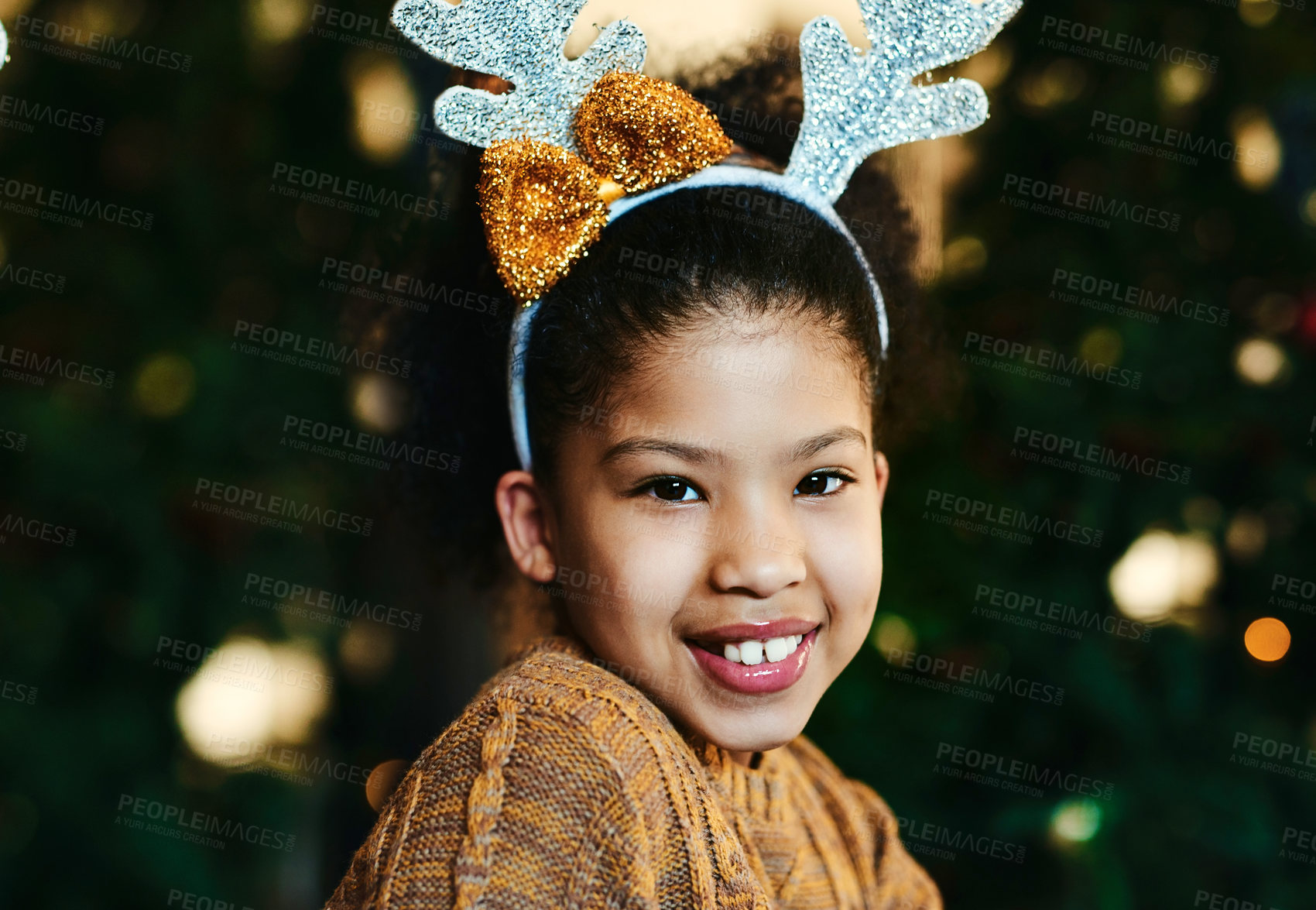 Buy stock photo Christmas, portrait and children with a girl in antlers on a dark background for festive season celebration. Face, smile and kids with a female child wearing reindeer horns headwear in the holidays