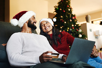 Buy stock photo Christmas, couple and laptop on sofa, credit card or happiness together, ecommerce or festive season in lounge. Xmas, love or woman with man, payment, online banking or happy for transaction on couch