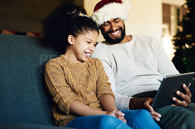 Buy stock photo Tablet, video call or movie with black family on christmas for bond, happiness and smile. Care, dad and child on sofa for festive holiday internet streaming together in happy family home.
