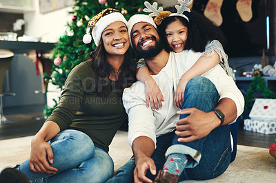Buy stock photo Portrait, Christmas and family celebration, happy or embrace together in living room. Xmas, love and mother with father, daughter and smile for holiday, hug or vacation for happiness, content or joy 
