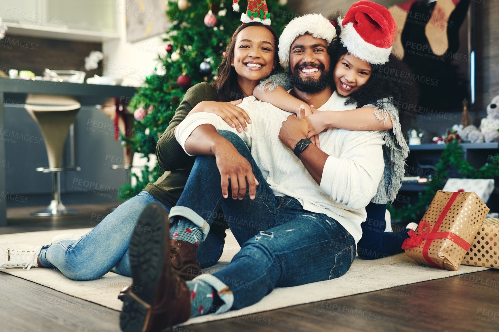 Buy stock photo Family portrait, christmas gift and love in holiday celebration, happy smile and relax on floor, decoration and home. Mother, father and girl celebrate festive, happiness and hug at house in brazil 