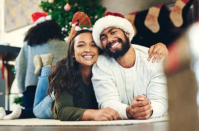 Buy stock photo Love, happy and portrait of a couple at christmas party relaxing on the floor together in living room. Happiness, smile and young man and woman at festive holiday event for xmas celebration at house.
