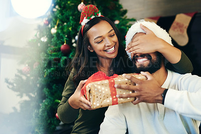 Buy stock photo Couple, Christmas gift surprise and holiday celebration, happy together with cover eyes and Christmas tree. Celebrate at home, Mexican man with woman, decoration and present secret with love.