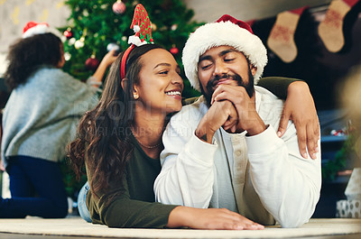Buy stock photo Couple hug, christmas and love at party, celebration and happiness on holiday in home living room. Man, woman and embrace to celebrate, romance and happy with smile, care and lounge in family home