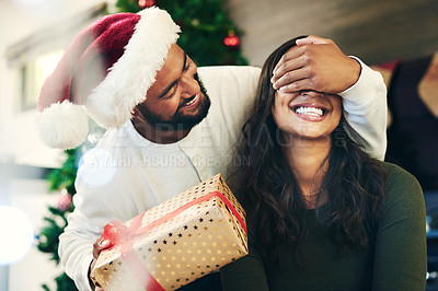 Buy stock photo Couple, Christmas and celebration with surprise and gift, happy on holiday with box and festive tradition. Celebrate, love and smile, cover eyes for present secret with man and woman from Mexico.